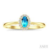 5x3 MM Oval Shape Blue Topaz and 1/20 Ctw Round Cut Diamond Halo Semi-Precious Ring in 10K Yellow Gold
