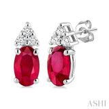 1/20 Ctw Oval Cut 5X3 MM Ruby and Round Cut Diamond Precious Earrings in 10K White Gold