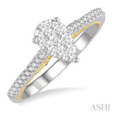 1/3 Ctw Pear Shape Round Cut Diamond Lovebright Ring in 14K White and Yellow gold.